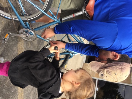 Helping daddy put a bottle cage on mommy s bike2